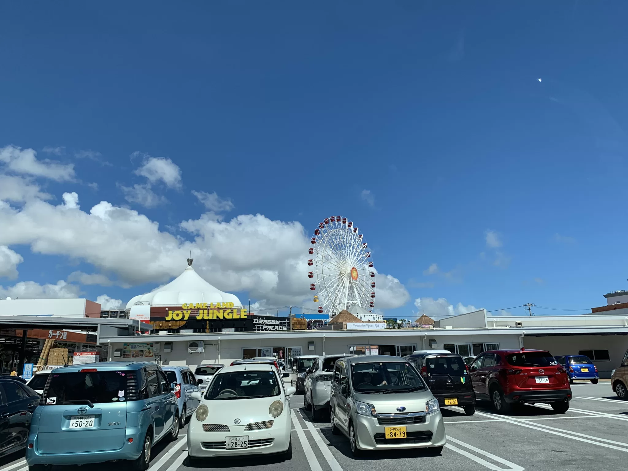 The SKYMAX60 Ferris wheel rising above American Village, photographed before it was dismantled